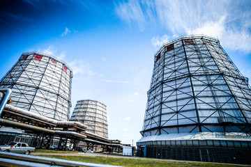 Fototapeta premium Industrial pipe smoke and construction of the building