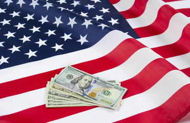 USA flag with dollars notes. American dream concept.