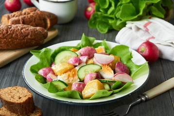 Vegetable salad with baked radish and potatoes