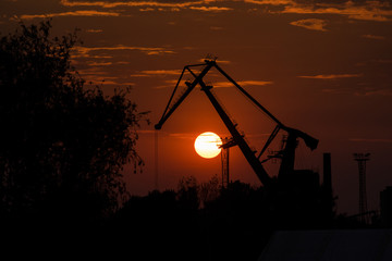 Port crane during sunset in Szczecin.