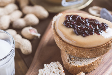 Peanut Butter and Jelly Sandwich on Rustic Wooden Cutting Board