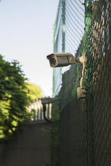 Obraz premium Street surveillance camera on the fence.