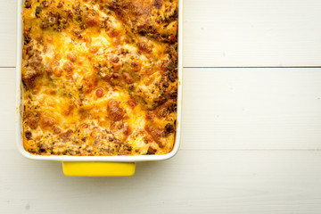 Homemade Meat Lasagna on White Wooden Table. Copy Space.