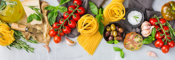 Fototapeta Italian food ingredients with pasta, tomatoes, cheese, olive oil, basil obraz
