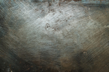 Textured metal surface with detailed traces of corrosion, rust and scratches