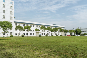 Factory building in the suburbs, industrial plant background