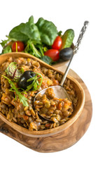 Turkish traditional Lentil salad and a slice of cucumber and green ezogelin, tarhuna. The view from the top. Isolated