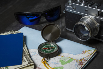 Preparation for summer vacation. Travel set of cameras, sunglasses Passport and map