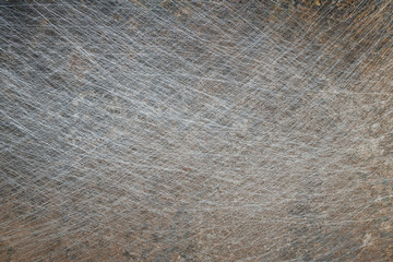 Textured metal surface with detailed traces of corrosion, rust and scratches