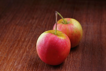 Fresh Juicy red apples on old wooden