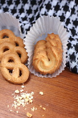fresh sweet cookies on wooden in background