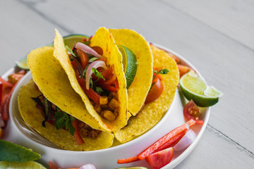 Colorful Mexican Tacos in Shells on Gray Background
