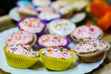 many Easter cupcakes in glaze beautifully decorated