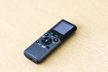 Grey digital dicaphone on a table