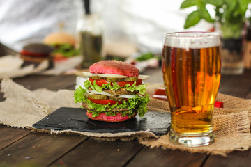 burgers on a slate plate and frothy beverage  - fast food (sandwich) - cuisine.  Food background