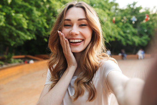 Close up of a smiling young girl taking selfie