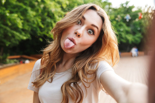 Close up of a funny young girl taking selfie
