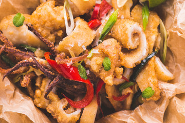 Squids Calamari Tentacle with Chili Pepper on Rustic Wooden Background