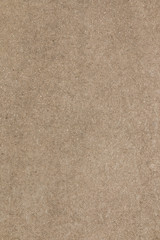 Fototapeta premium Brown concrete floor texture. Close-up photo of scabrous background. Vertical orientation