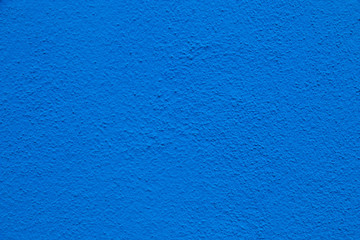 Blue wall background. Painted rought concrete surface texture