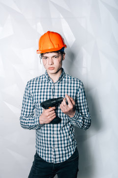 Master-Builder in their working clothes, with drill in his hands