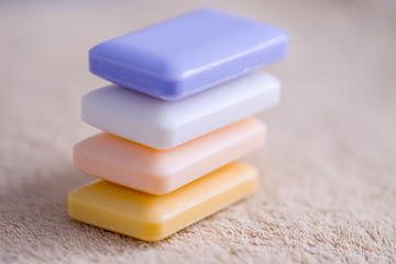 four bars of soap on a towel