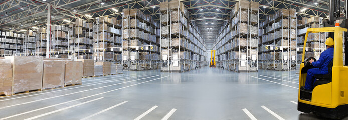 Huge distribution warehouse with high shelves - obrazy, fototapety, plakaty