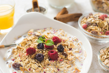 Freshly Prepared Muesli With Milk, Chia Seeds, Berries and Cinnamon. Bright Sunny Morning with Healthy Breakfast.