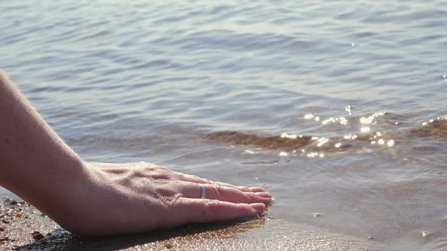 Woman touching water