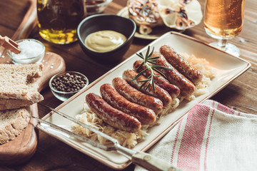 Traditional German Grilled Sausages with Cabbage Salad, Mustard and Beer