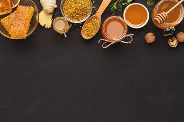 Various types of honey on wooden platter