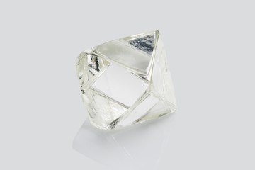 Transparent rough diamond isolated on white background