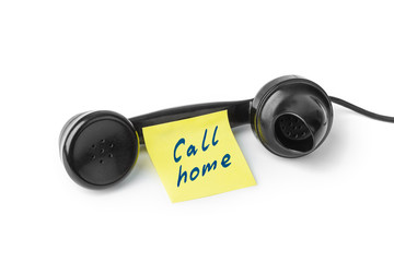Vintage telephone and paper Call home
