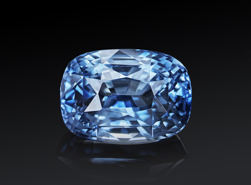 Luxury blue transparent sparkling gemstone  shape cushion cut sapphire isolated on black background