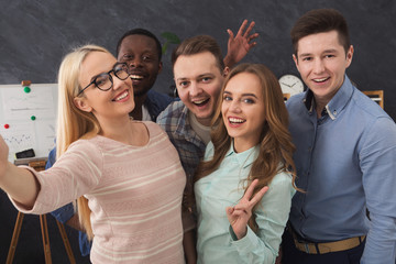 Confident business people taking selfie