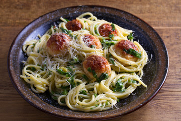Spaghetti with spinach and chicken meatballs. Pasta with meatballs