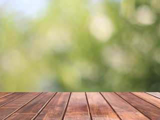 Wooden table with green bokeh is background, Wooden table top