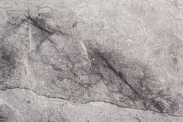 Naklejka premium Fragment of stone texture with scratches and cracks. Natural Background.