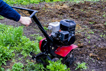 cultivator on a plowed field