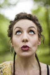 Young woman makes facial gesture