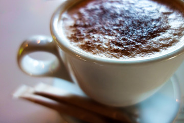 Cup of morning coffee with blurred background 