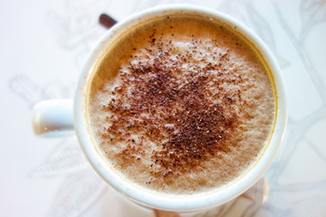 Cup of morning coffee with blurred background 