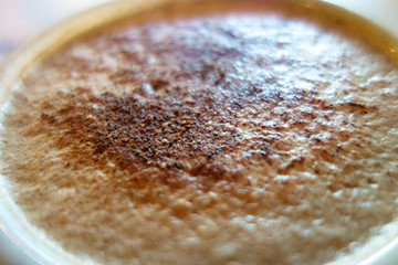 Cup of morning coffee with blurred background 