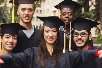 Group selfie of students celebrating graduation