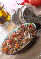 plate of lentil salad with tomatoes and onions