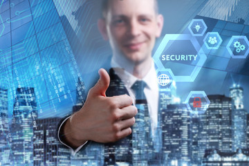 Business, Technology, Internet and network concept. Young businessman working on a virtual screen of the future and sees the inscription: Security
