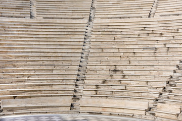 Greece, Athens: Bench seats as part of famous old ancient Odeon of Herodes Atticus theater in the city center of the Greek capital - concept culture history sightseeing architecture entertainment