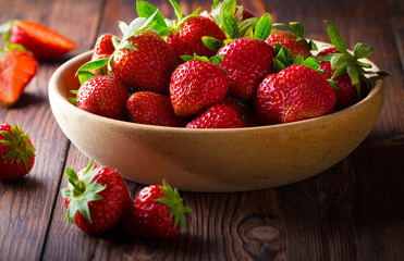 strawberry wooden plate spoon Vintage background
