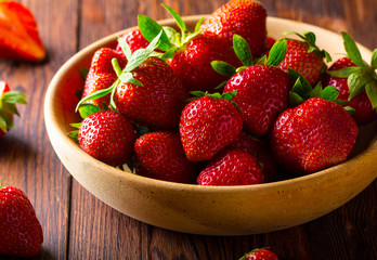 strawberry wooden plate spoon Vintage background
