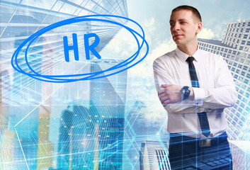 The concept of business, technology, the Internet and the network. Young businessman showing inscription: HR